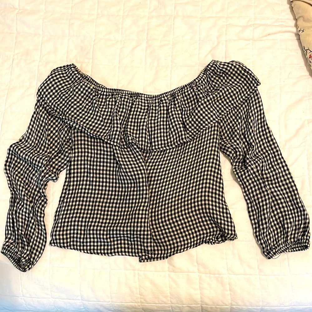 Black and white checkered off-the-shoulder blouse